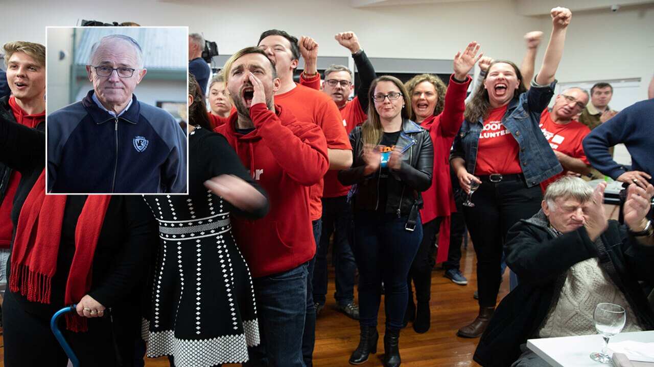 Inset: Malcolm Turnbull. Labor supporters celebrate a win in Braddon.
