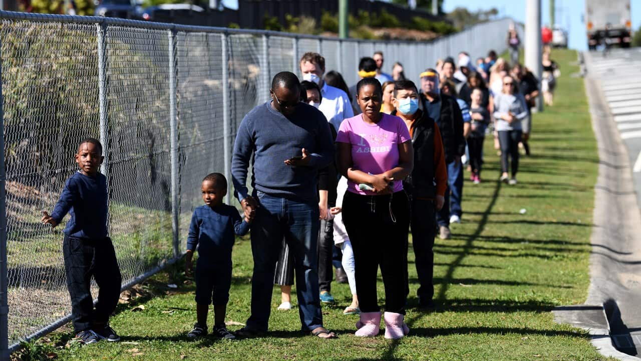 People line up to get COVID-19 tested at the Parklands Christian College in Logan, south of Brisbane, Wednesday, July 29, 2020. The school has been temporarily closed after an employee tested positive for COVID-19. (AAP Image/Dan Peled) NO ARCHIVING