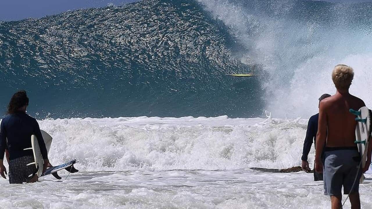 A surfer is barrelled at Snapper Rocks on the Gold Coast,