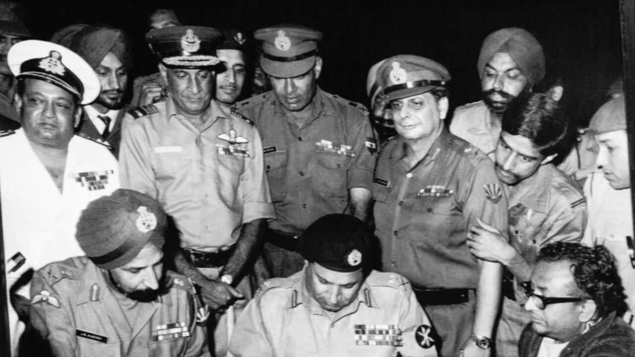 Pakistans Gen. Niazi, signs the surrender document as Joint Commander of India and Bangladesh Forces, Gen. Aurora, left, in Dacca, Bangladesh, Dec. 16, 1971.
