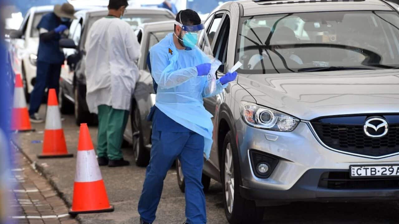 Members of the public queue for a COVID-19 tests at a clinic at Bondi Beach, Sydney.