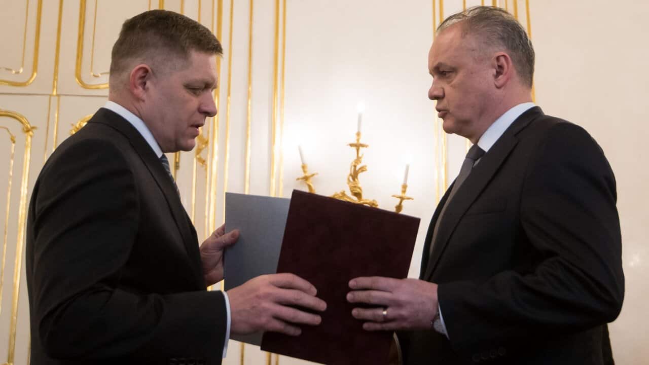Slovak President Andrej Kiska receives a resignation letter from Slovak Prime Minister Robert Fico