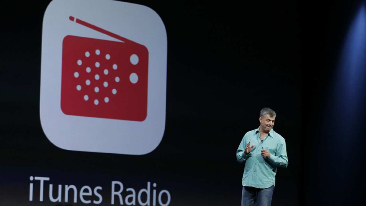 An Apple employee introduces iTunes Radio