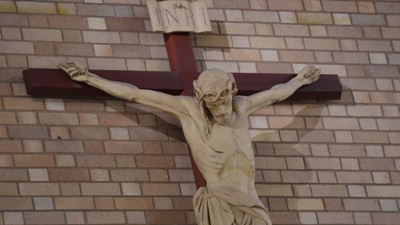 A crucifix is seen inside a church