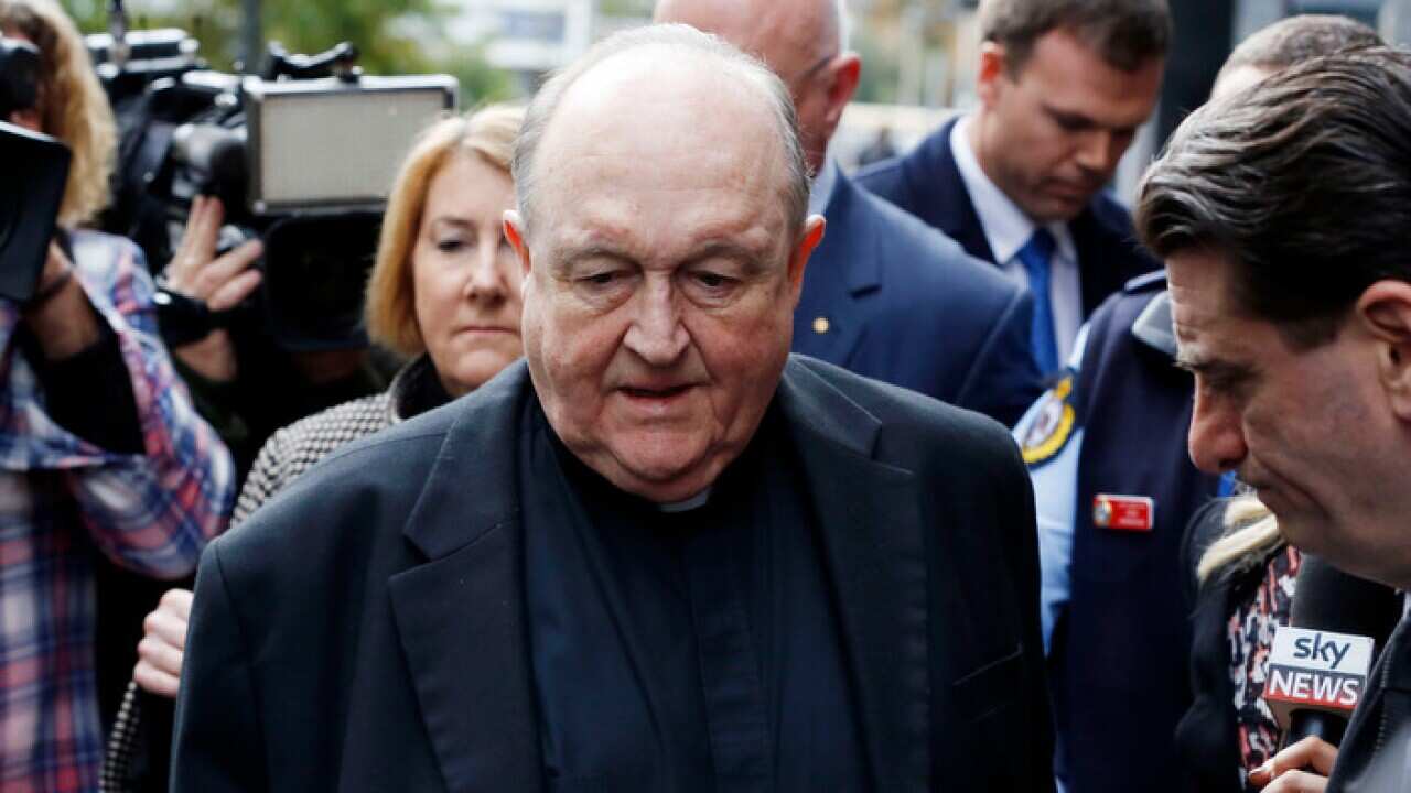 Archbishop Philip Wilson leaves Newcastle Local Court, in Newcastle after sentencing, Tuesday, July 3, 2018. The Adelaide Archbishop has been found guilty of concealing historical child sexual abuse. (AAP Image/Darren Pateman)