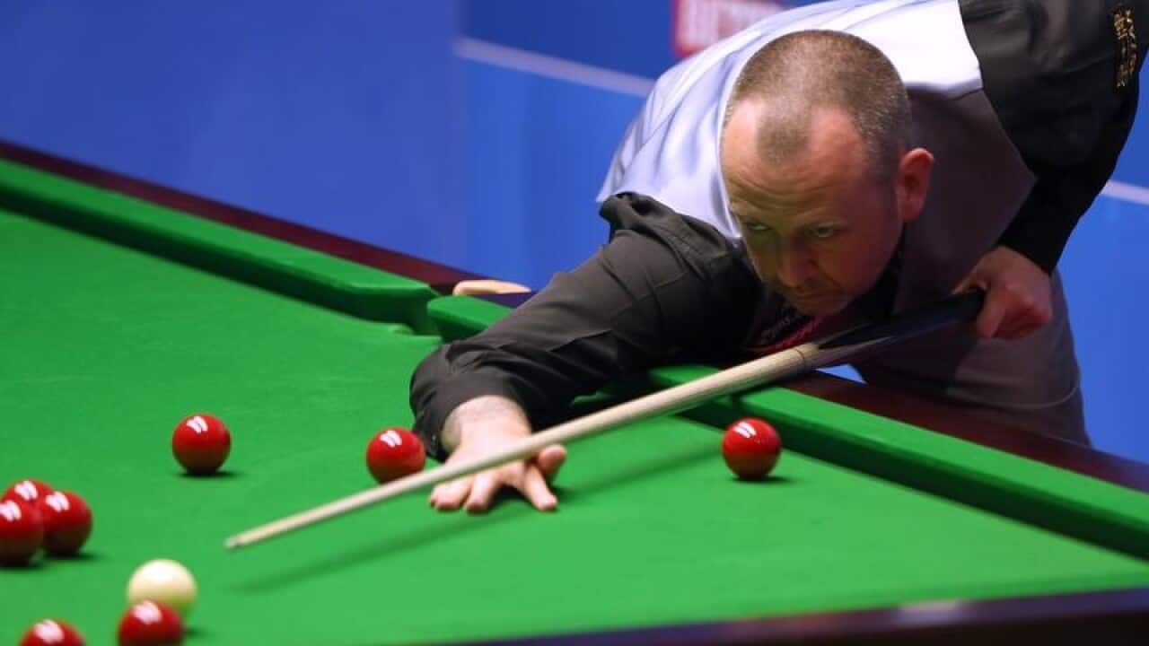 Mark Williams in action against Jimmy Robertson during day four.