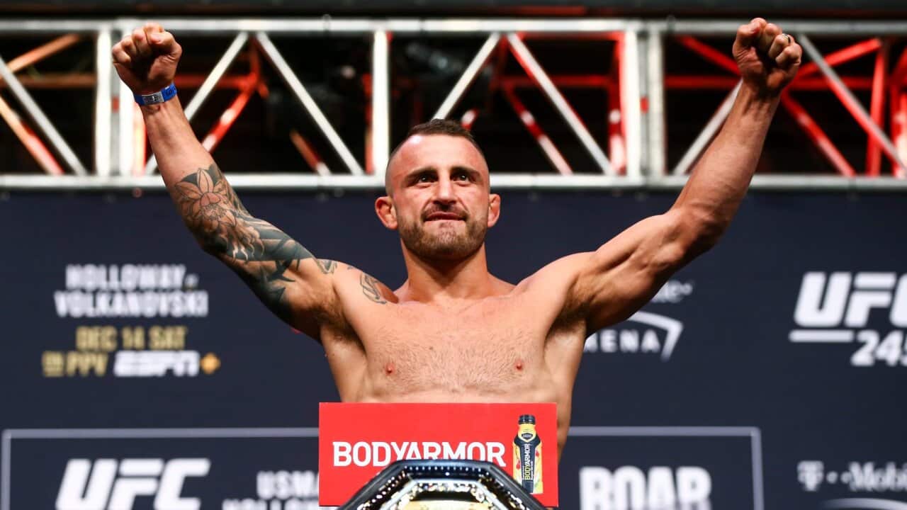 Alexander Volkanovski poses during the ceremonial weigh-in event ahead of his fight against Max Holloway in UFC 245 at T-Mobile Arena in Las Vegas, Friday, Dec. 13, 2019. (Chase Stevens/Las Vegas Review-Journal via AP)