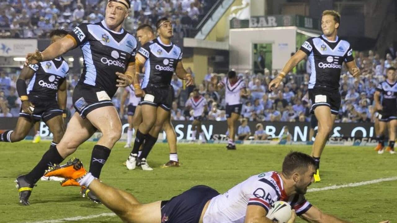 James Tedesco of the Roosters scores.