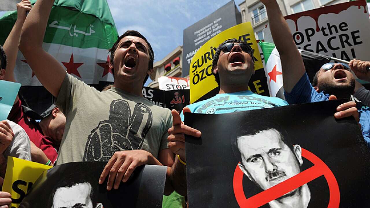 assad_L_protest_bahrain_120528_getty_771259388