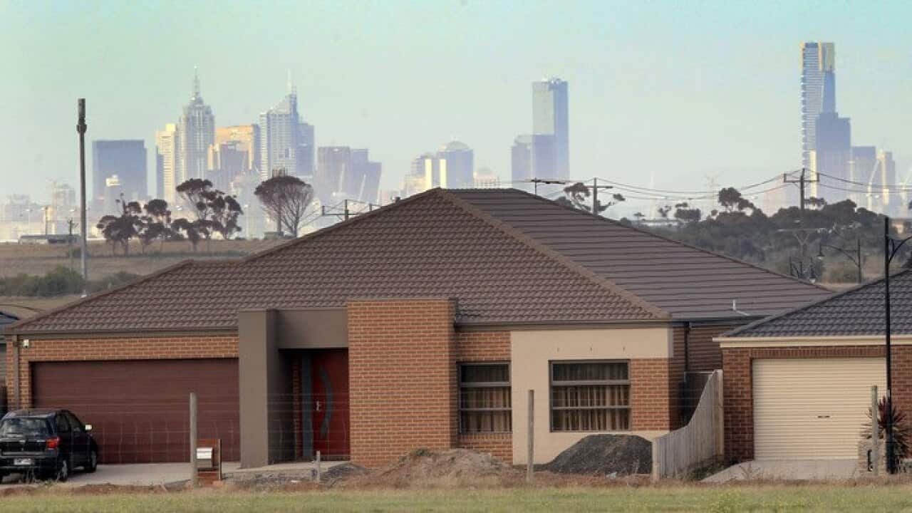 Melbourne's city centre towers above suburban housing