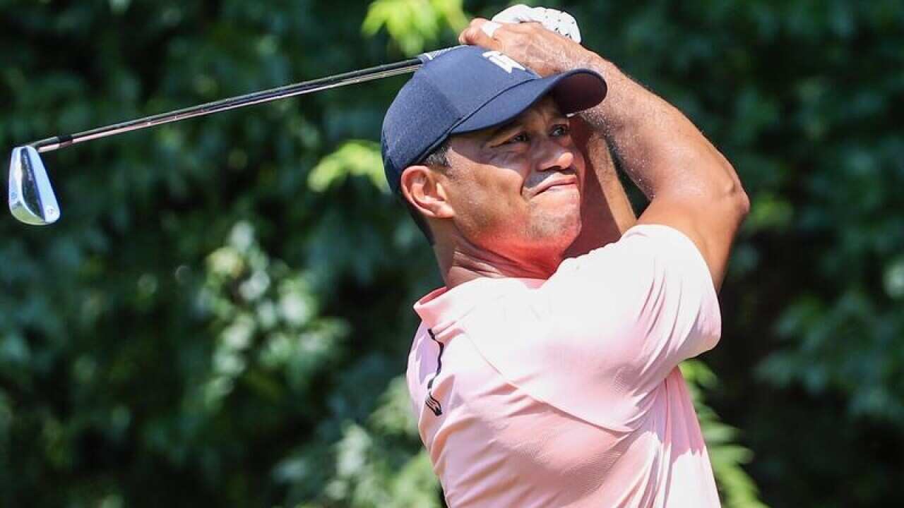 Tiger Woods hits his tee shot in the Tour Championship.