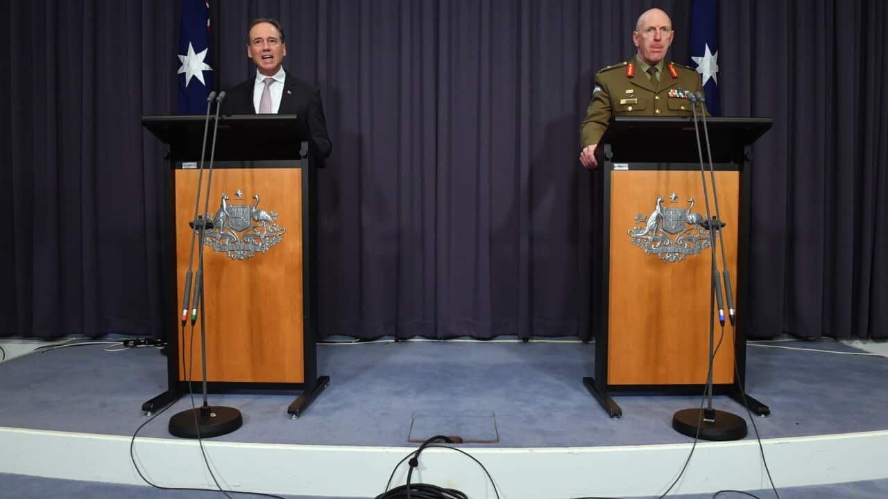 Minister for Health Greg Hunt and COVID-19 Taskforce Commander, Lieutenant General John Frewen at a press conference at Parliament House in Canberra, Sunday, October 24, 2021.