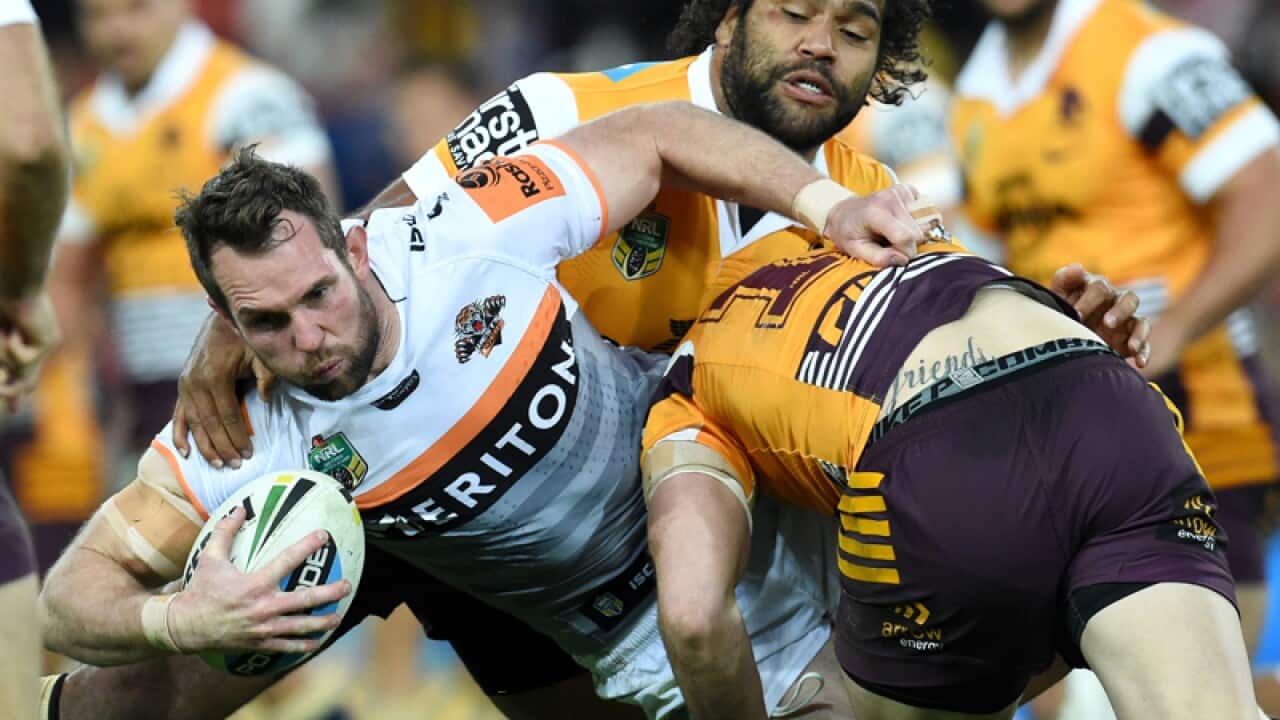 Wests Tigers' Pat Richards is tackled