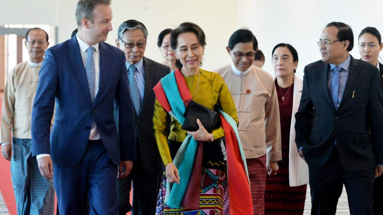 Myanmar's State Counsellor Aung San Suu Kyi and Wouter Jurgens, Netherlands ambassador to Myanmar, speaking as Suu Kyi prepares to leave Myanmar.