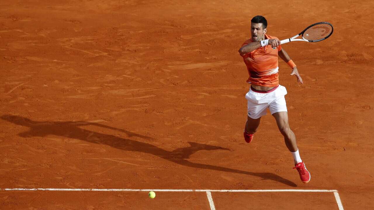 Novak Djokovic of Serbia returns the ball to Alejandro Davidovich Fokina of Spain during their match at the 2022 Monte-Carlo Masters tennis tournament