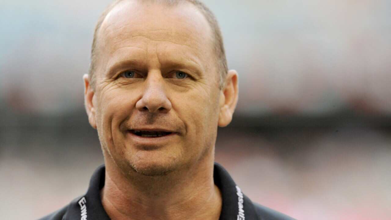 Port Adelaide coach Ken Hinkley watches his side warm up