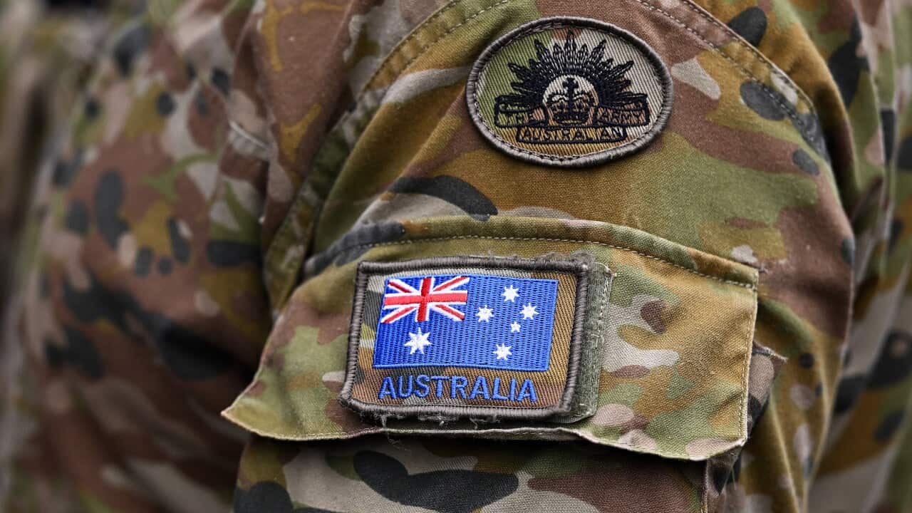 Detail of an Australian flag pictured on the uniform of an Australian Army personnel