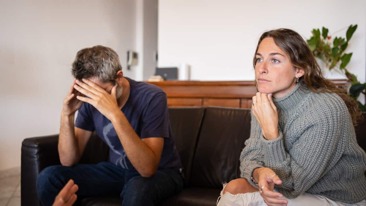 Man doing a desperate gesture during couple's therapy with a psychologist