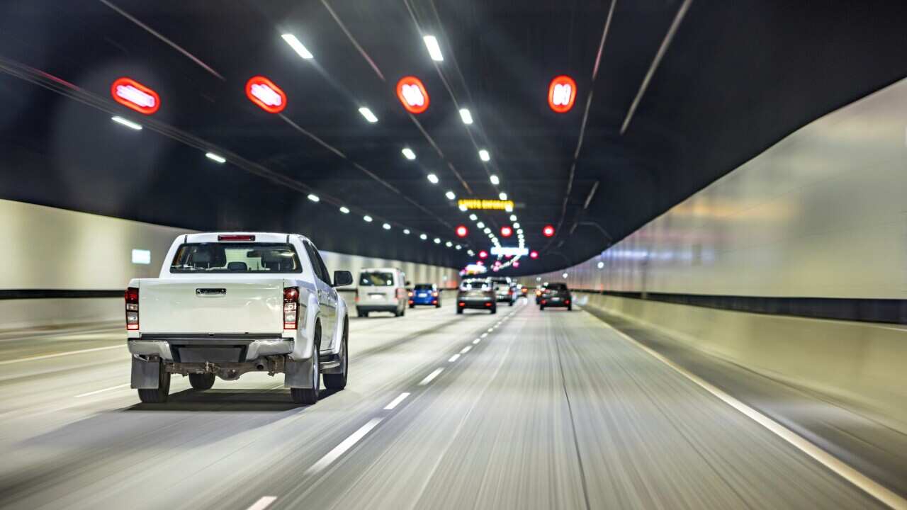 Driving in tunnel, ute pickup truck, highway road
