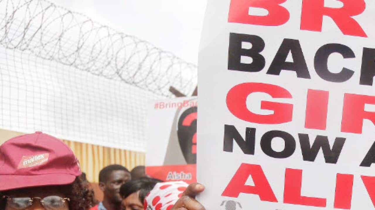 File image of a woman protesting to 'bring back our girls' (AAP)