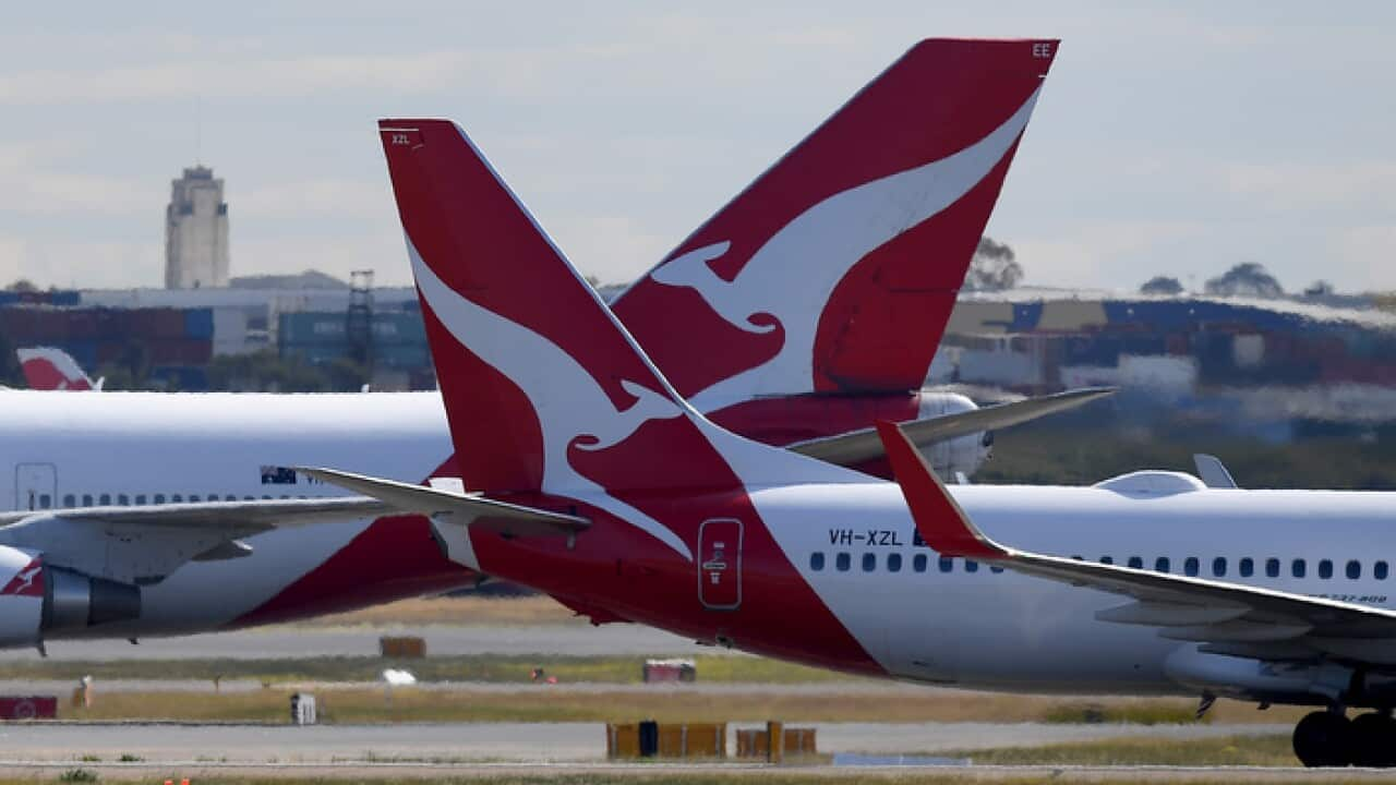 Qantas aircraft are seen at Sydney Airport, in Sydney, Wednesday, August 22, 2018. (AAP Image/Dan Himbrechts) NO ARCHIVING