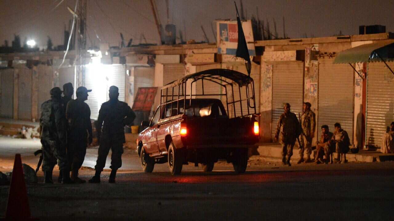 Pakistani security forces arrives to take position near the military airbases after an attack by militants (AAP)