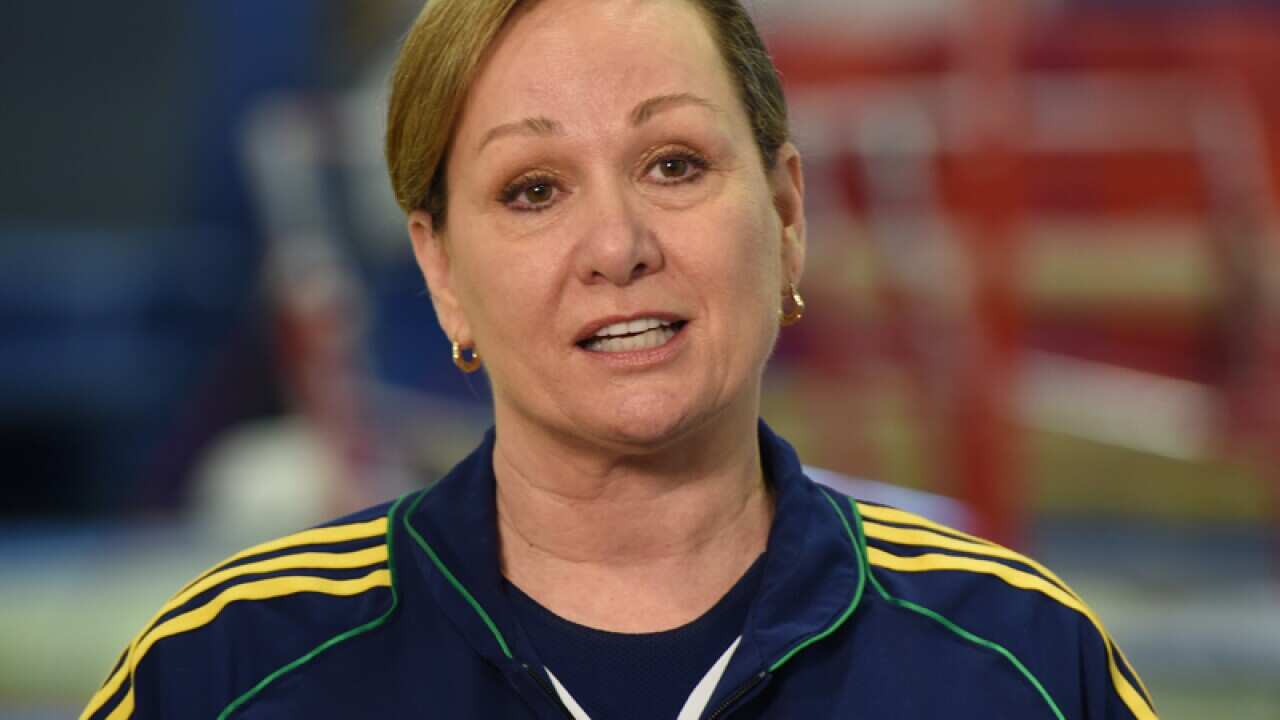 Gymnastics team coach Peggy Liddick