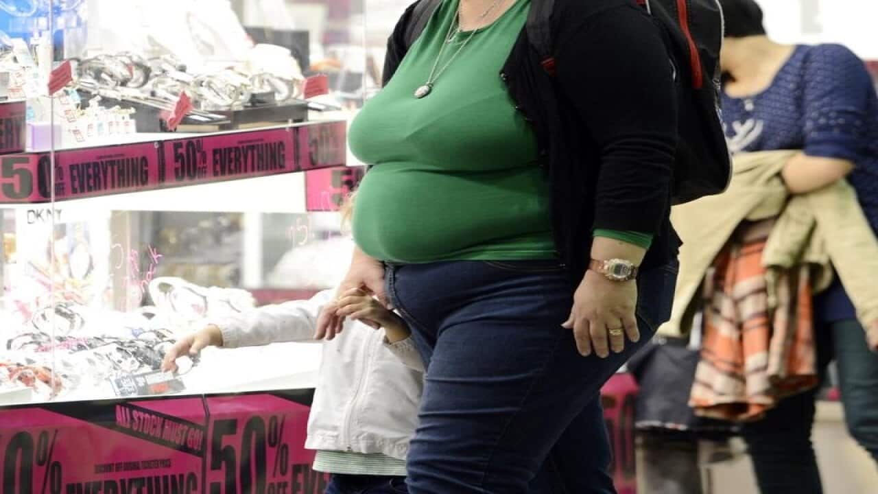 An overweight person in a mall