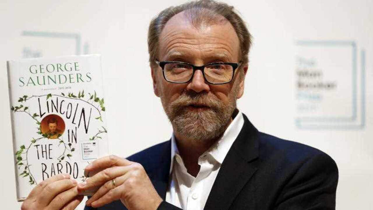 Author George Saunders of the United States with his book 'Lincoln in the Bardo' during a photocall with all six shortlisted authors of the 2017 Man Booker Prize.