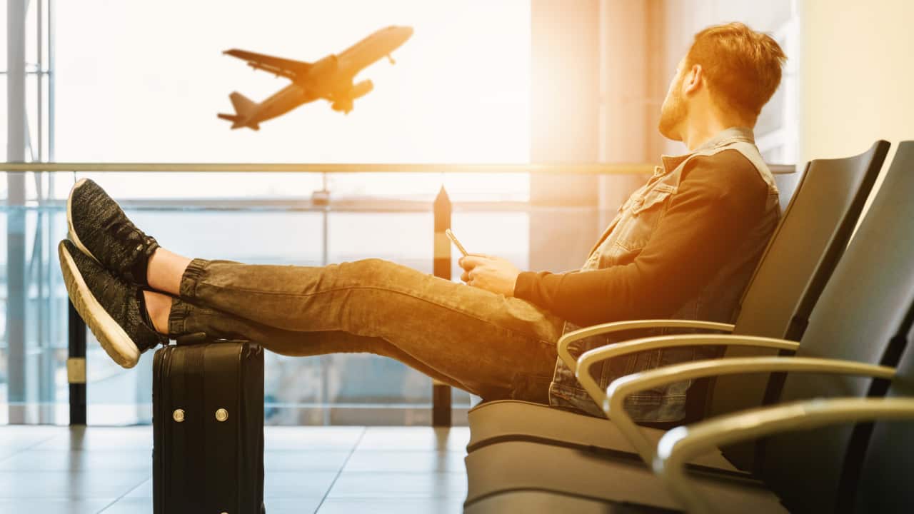 Man in airport waiting for boarding