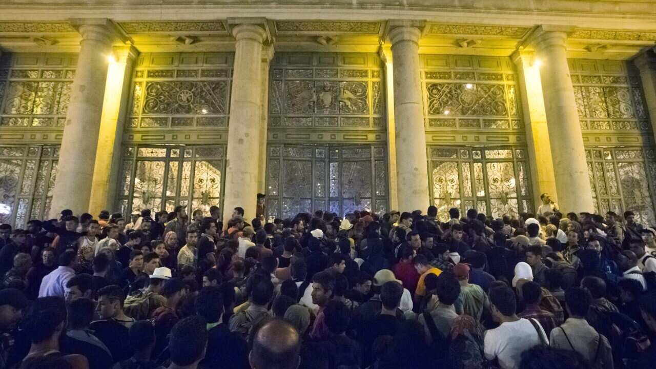 Migrants wait to board a train to Germany at the Keleti Railway Station in Budapest, Hungary, 01 September 2015.