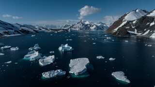 Melting icebergs on arctic water.