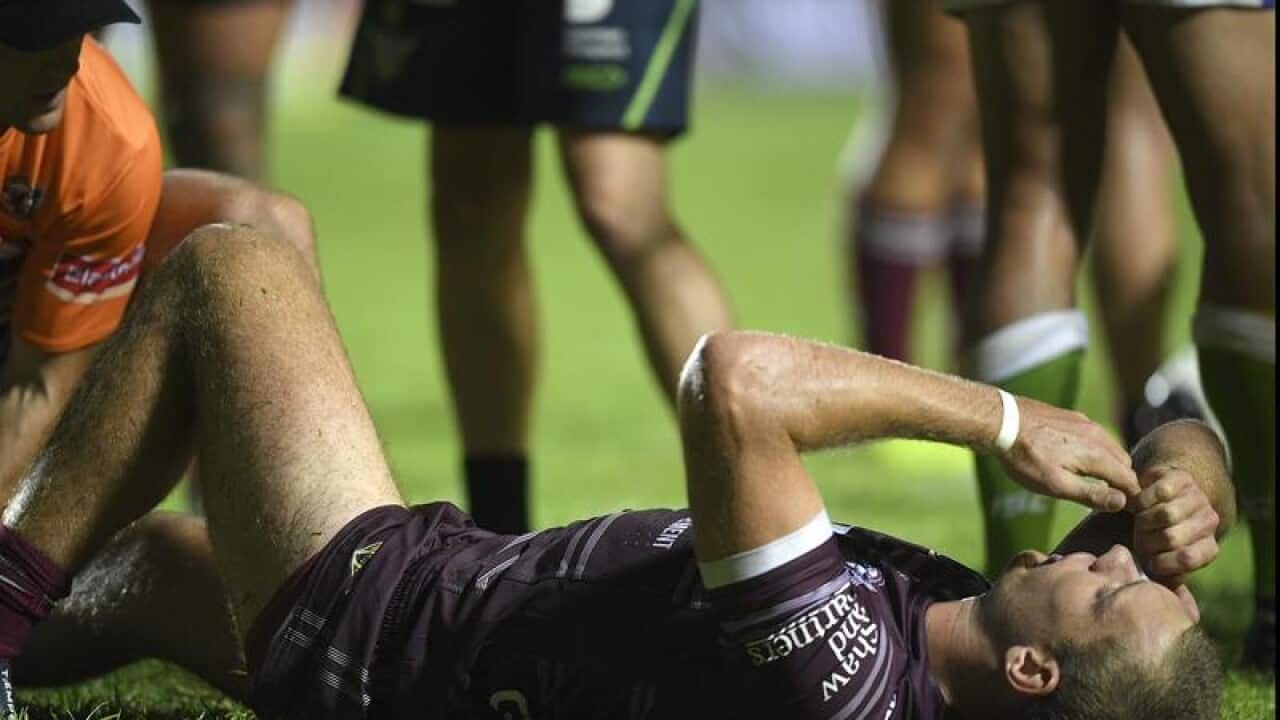 Tom Trbojevic of the Sea EAgles receives medical attention