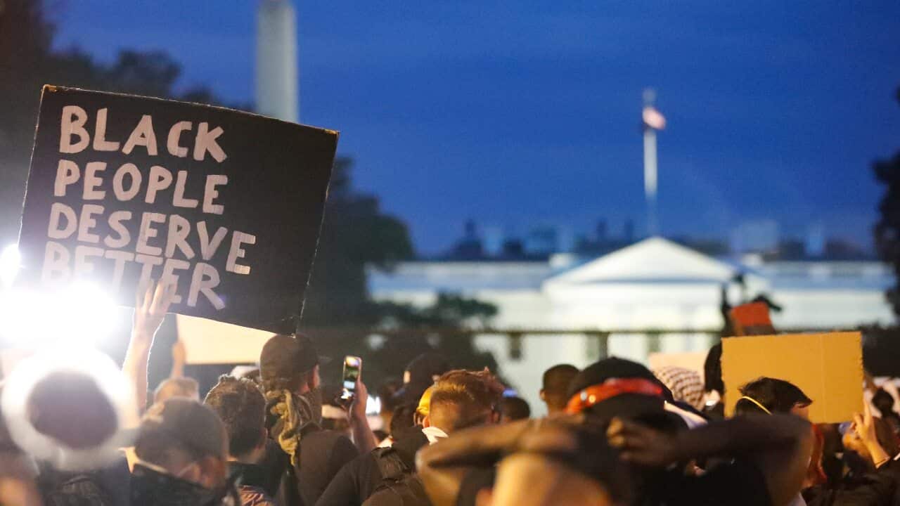 Demonstrators gather to protest the death of George Floyd, Tuesday, 2 June, 2020, near the White House in Washington