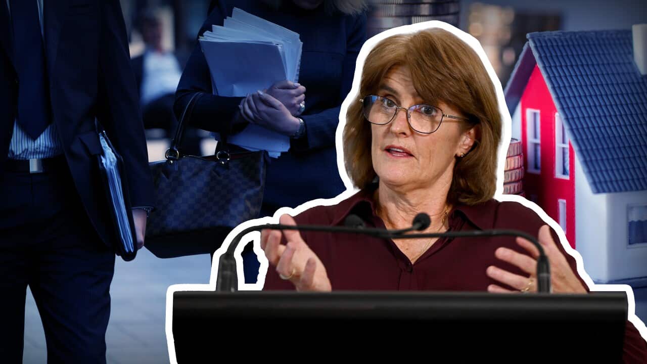RBA governor Michele Bullock standing at a podium with images of office workers and a house in the background.