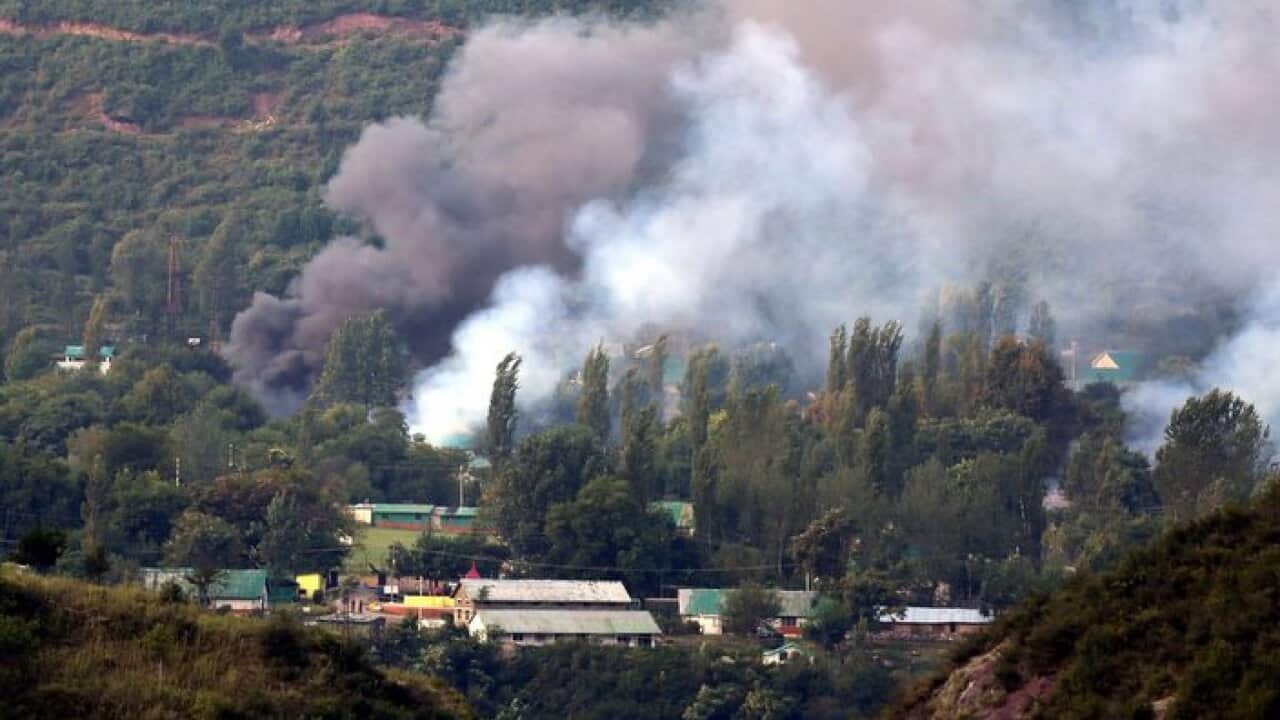 Smoke billows out from inside an Indian Army base which was attacked by suspected militants in Uri, some 115 west of Srinagar, the summer capital of Indian Kashmir, 18 September 2016. At least 17 Indian Army soldiers and four militants were killed after a
