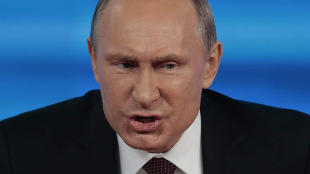 Vladimir Putin visiting the explosion site in Volgograd