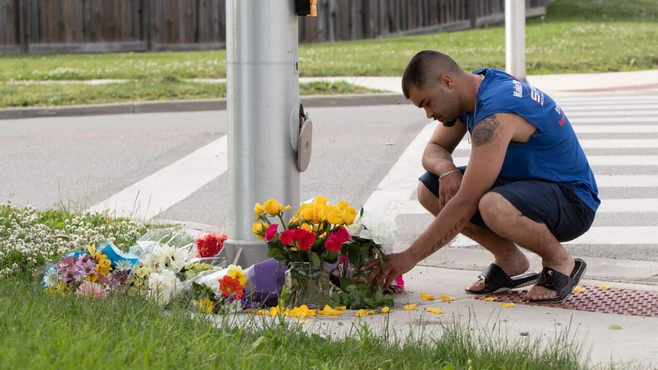 A man pays his respects at the scene where a pickup truck driver struck and killed four members of a Muslim family in London, Ontario, Canada on 7 June.