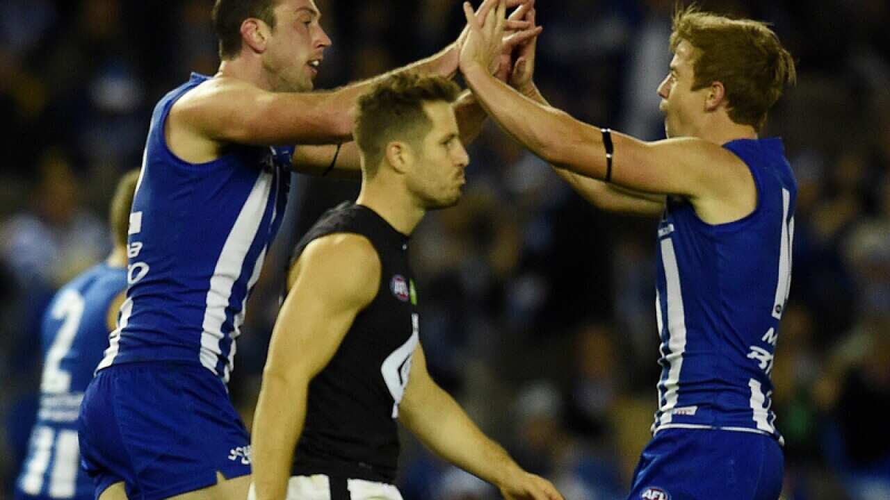 Todd Goldstein of the Kangaroos scores a goal