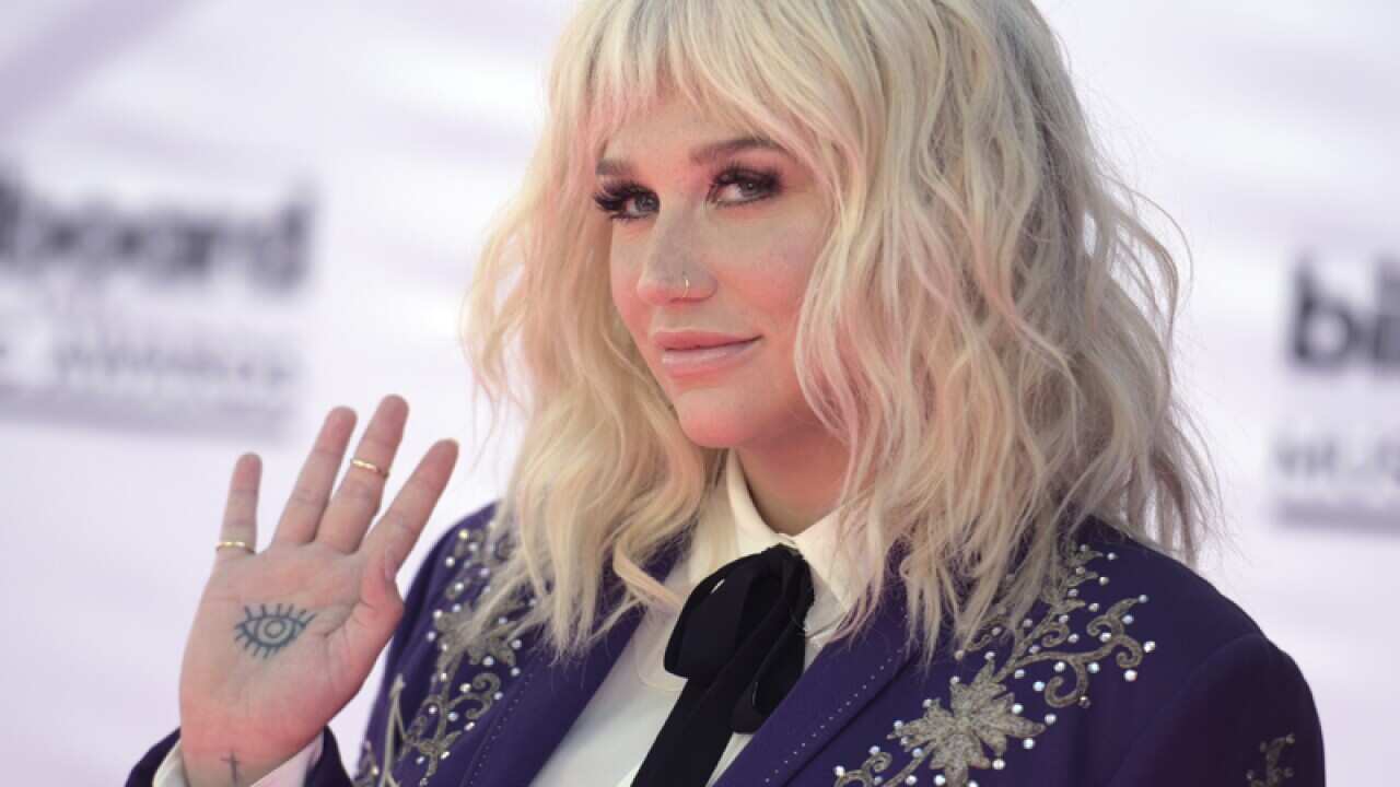 Kesha arrives at the Billboard Music Awards
