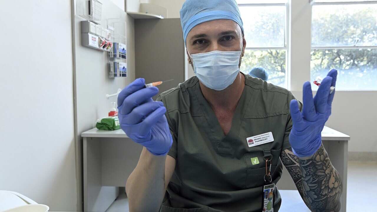 Pharmacist Blanko Radojkovic prepares a simulated vaccine during a simulation of COVID-19 vaccine process at the Sydney Local Health District Vaccination Hub in Camperdown, NSW, Friday, February 19, 2021. (AAP Image/Kate Geraghty, Pool) NO ARCHIVING