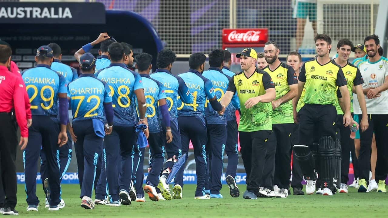 Captain Aaron Finch (C) of Australia and team mates shake hands with players from Sri Lanka after winning the ICC Men's T20 World Cup cricket match between Australia and Sri Lanka, at Dubai International Cricket Stadium, Dubai, Thursday, October 28, 2021.