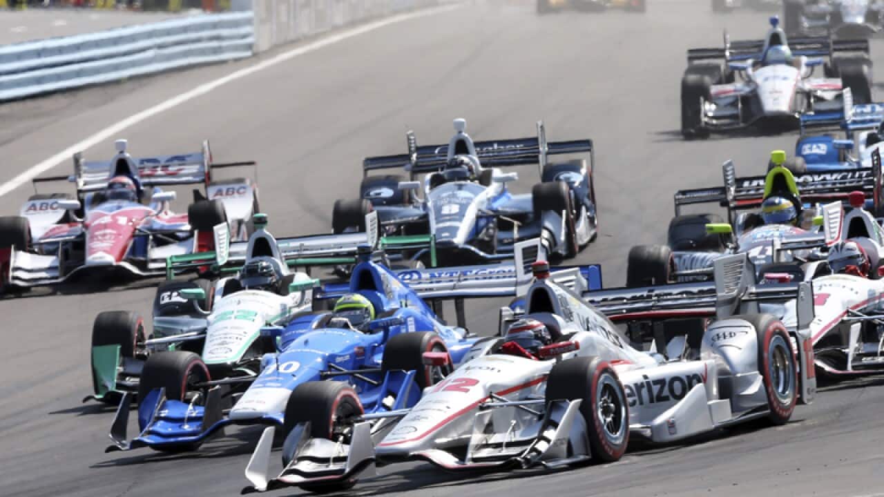 Will Power, of Australia, (12) leads