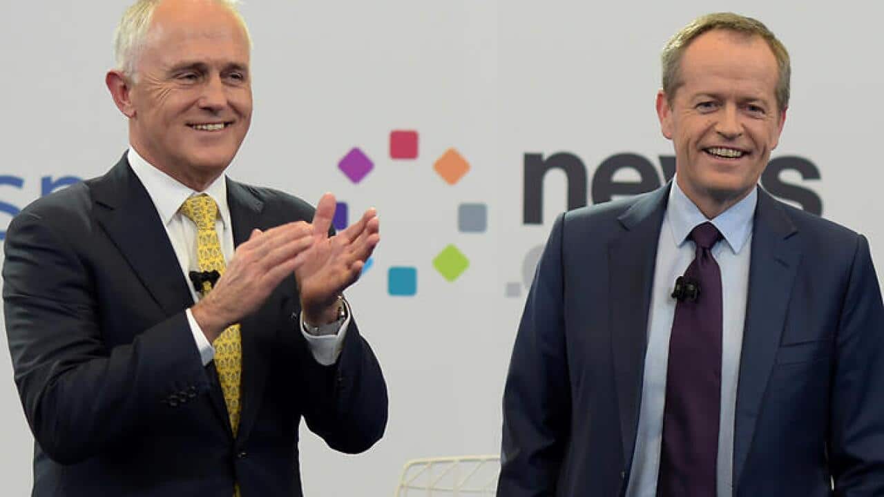 Australian Prime Minister Malcolm Turnbull and Australian Opposition Leader Bill Shorten react at the end of a leaders debate hosted by Facebook Australia and News.com.au in Sydney, Friday, June 17, 2016. (AAP Image/Lukas Coch/POOL) NO ARCHIVING