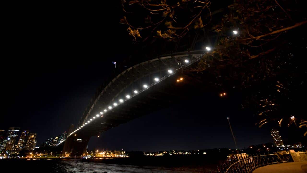 The Harbour Bridge is seen during Earth Hour in Sydney in 2019
