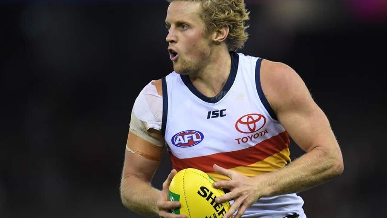 Rory Sloane of the Crows is seen in action during Round 3.