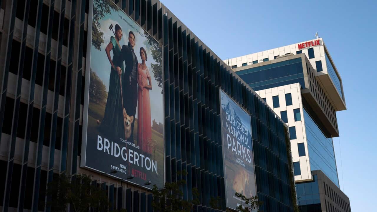 An advertisement for the popular Netflix show Bridgerton is seen outside its office building in Los Angeles (AP)