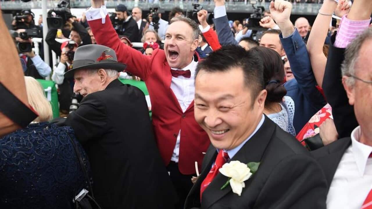 Fans cheer Redzel winning the Everest at Randwick.