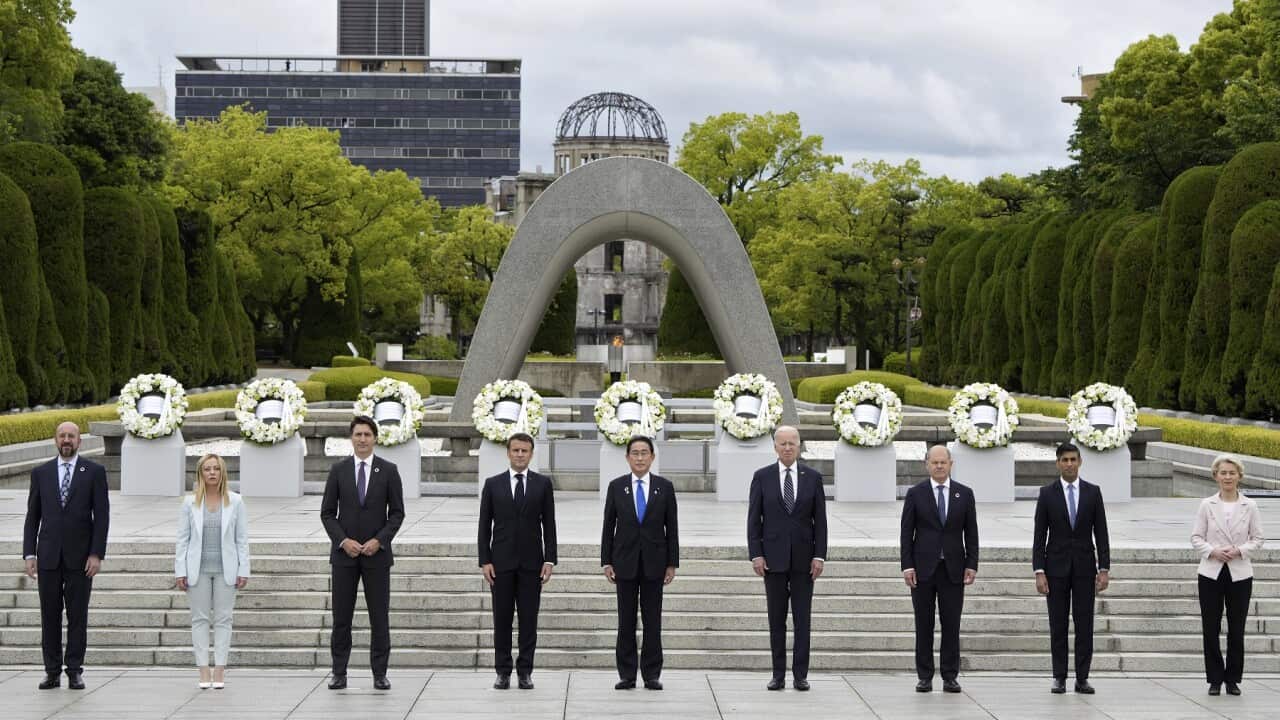 Leaders at the G7 summit pose for a group photo after laying wreaths at the cenotaph for Atomic Bomb Victims in Hiroshima