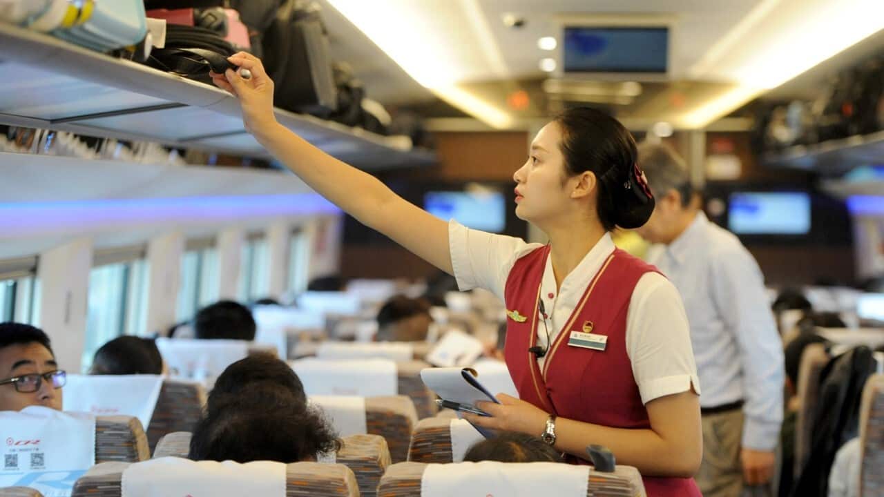 An attendant works on 'Fuxing' bullet train on September 21, 2017 in Xuzhou, Jiangsu Province of China (Visual China Group via Getty Images)